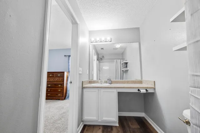 a white toilet sitting next to a bath tub