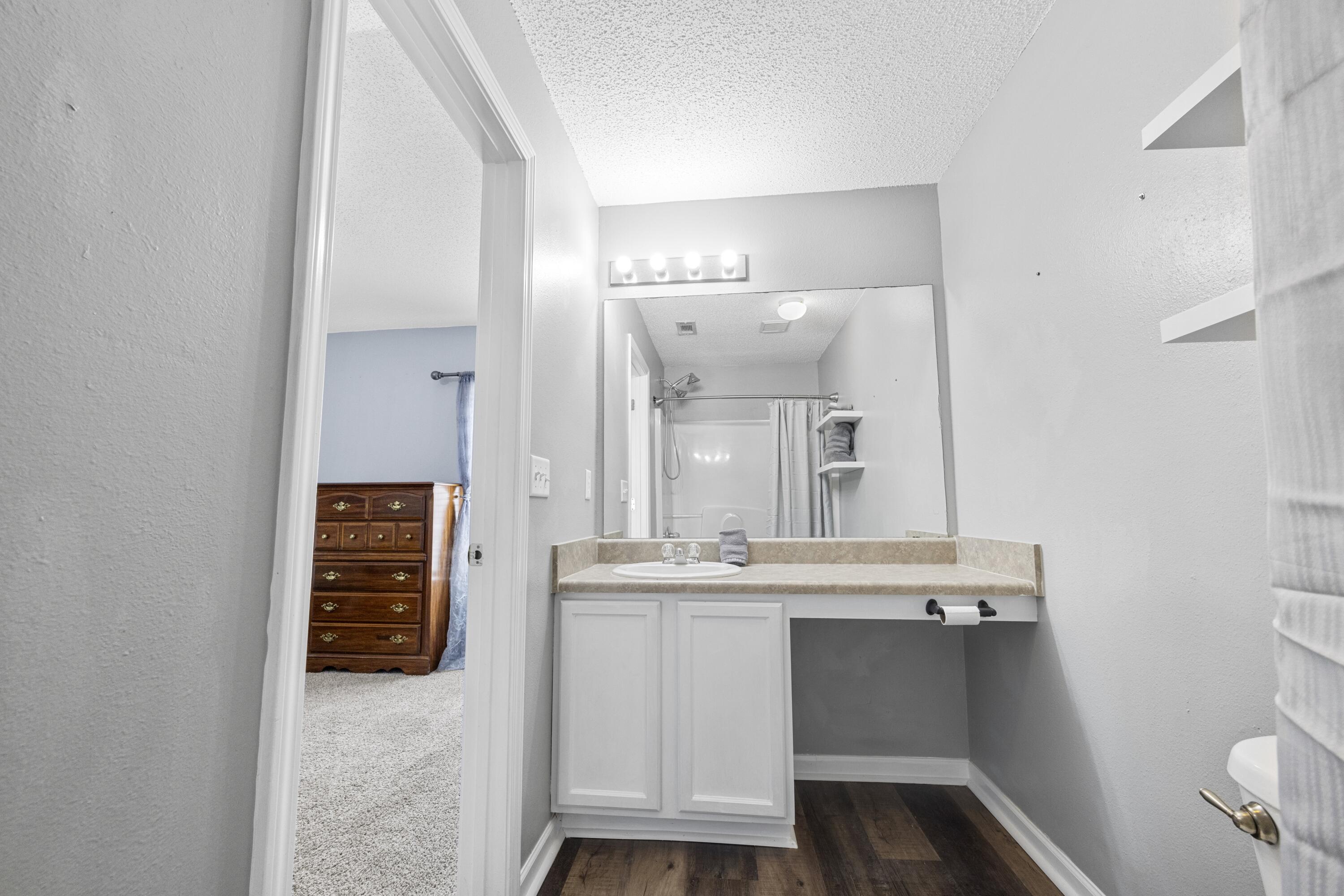 313 Crooked Pine Trail Crestview, FL 32539 - Photo 22 of 43 a bathroom with a sink and a mirror