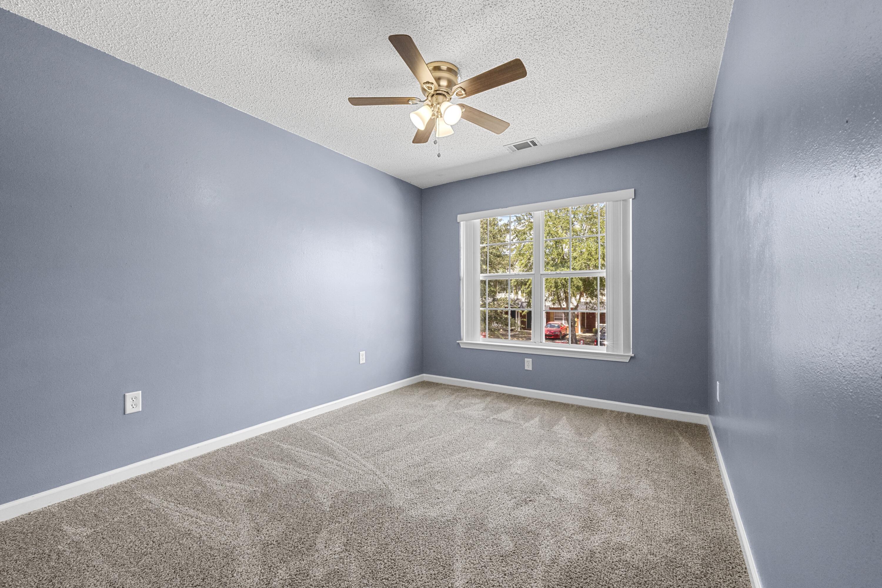 313 Crooked Pine Trail Crestview, FL 32539 - Photo 26 of 43 an empty room with window and ceiling fan