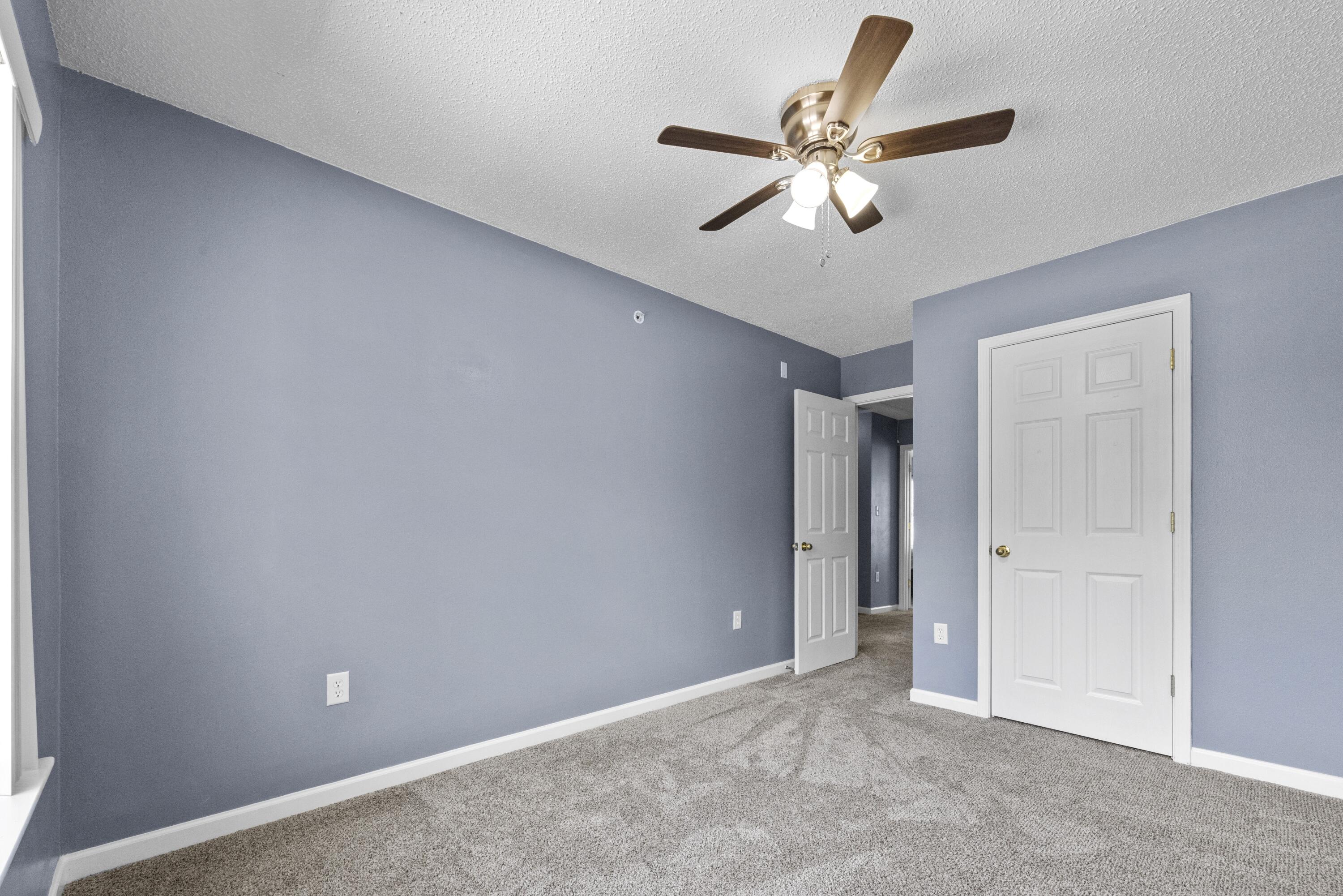 313 Crooked Pine Trail Crestview, FL 32539 - Photo 27 of 43 a view of an empty room with a ceiling fan