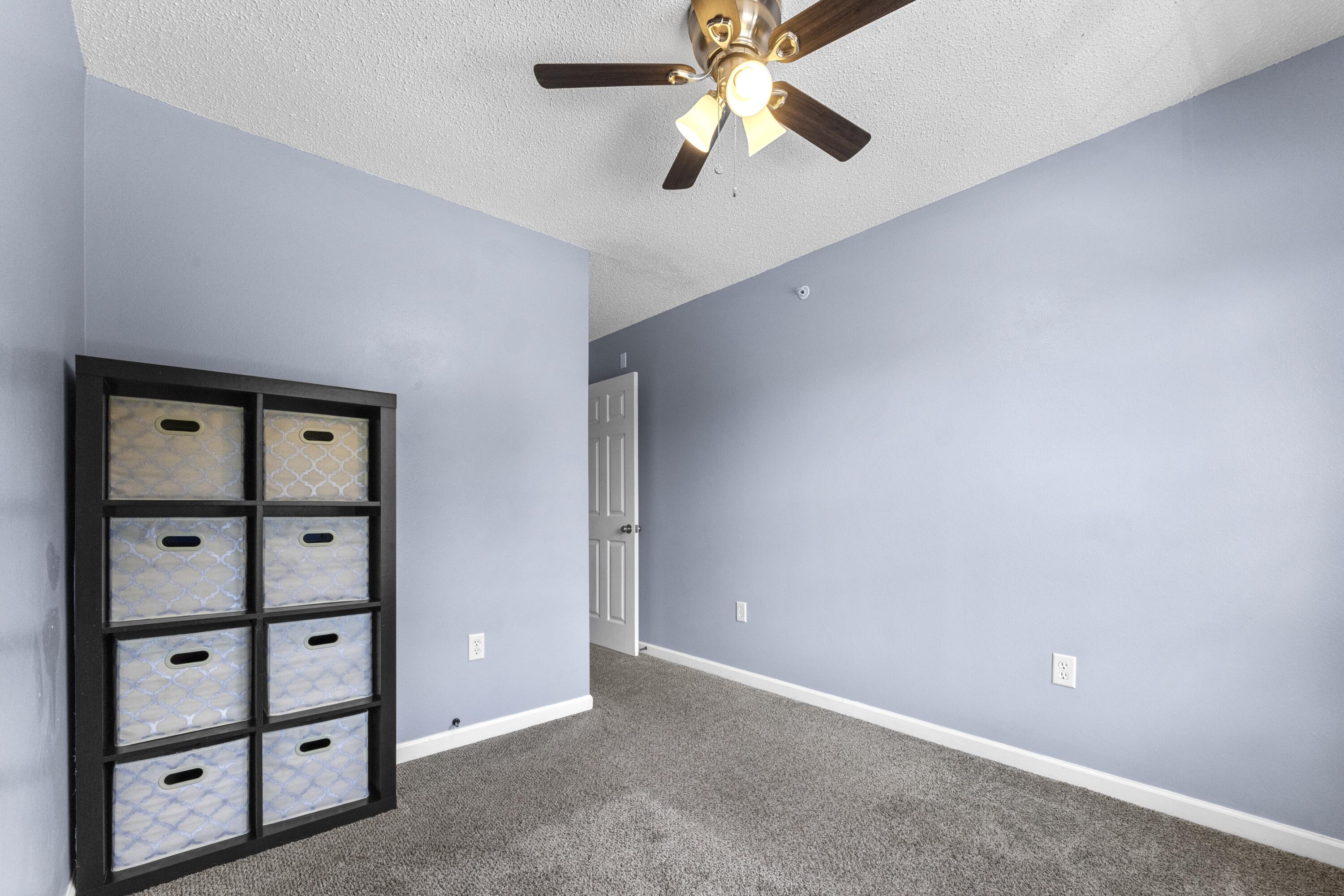313 Crooked Pine Trail Crestview, FL 32539 - Photo 30 of 43 a view of a ceiling fan with a large window