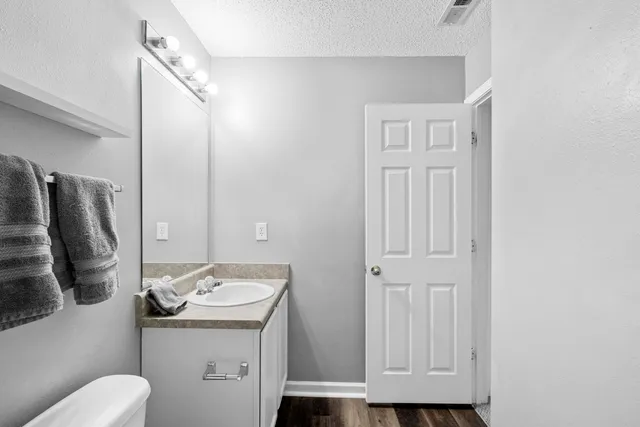 a bed room with furniture and gym equipment