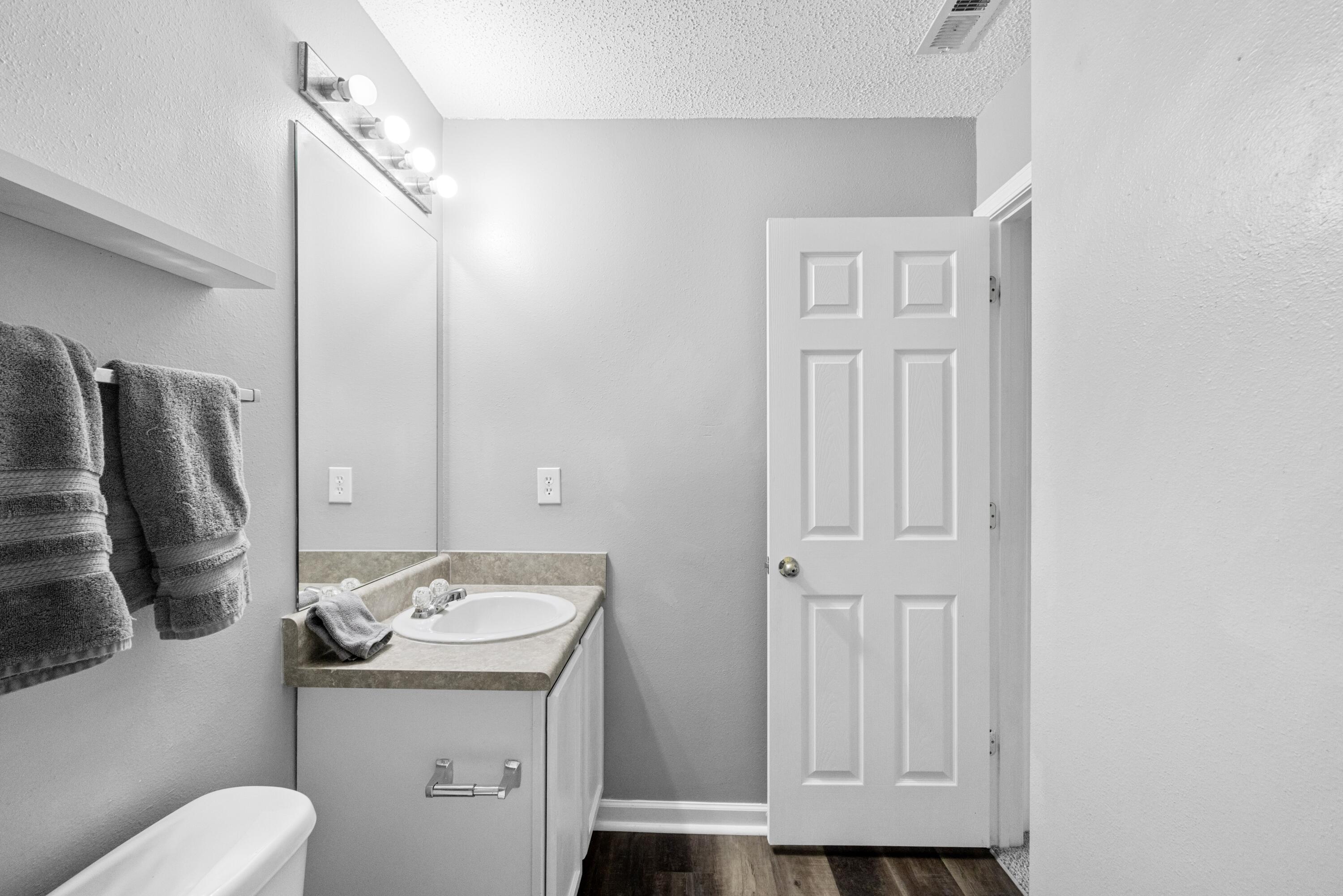313 Crooked Pine Trail Crestview, FL 32539 - Photo 34 of 43 a bathroom with a sink a toilet and vanity