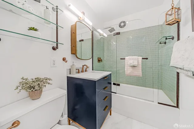 a bathroom with a tub sink and mirror