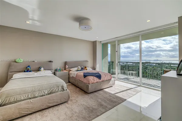 a bedroom with a bed and glass window
