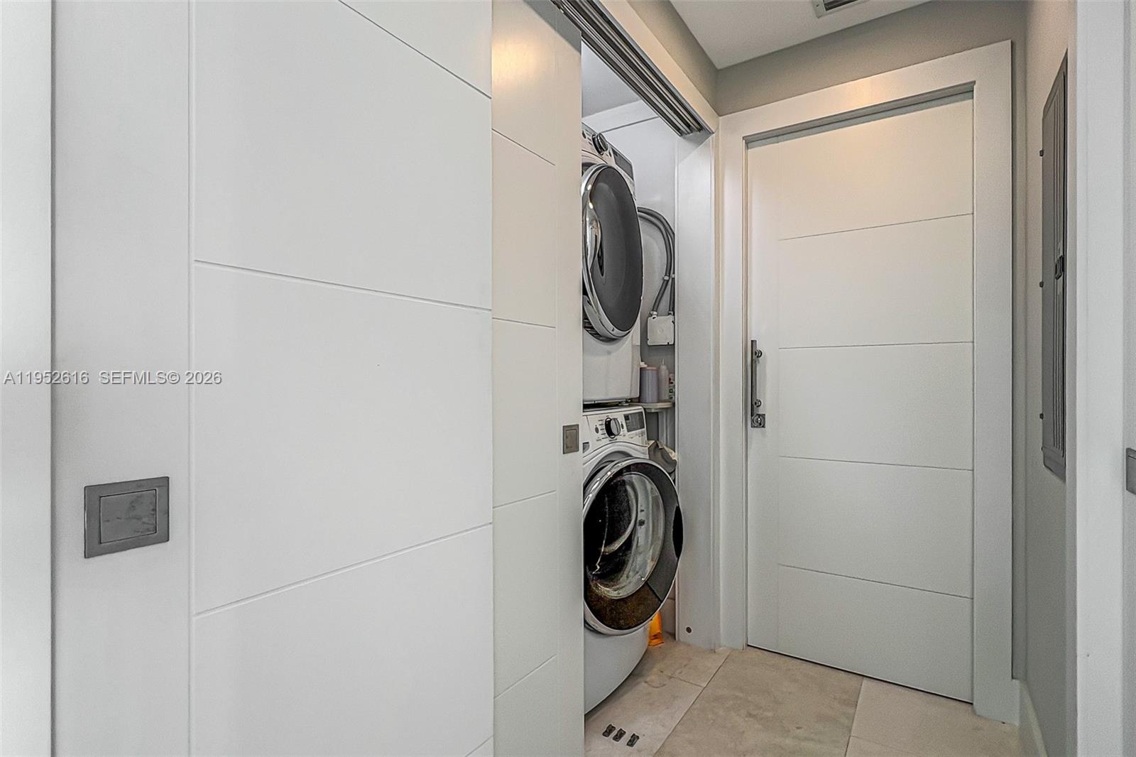 3400 Southwest 27th Avenue, Unit 802 Miami, FL 33133 - Photo 19 of 19 a utility room with dryer and washer