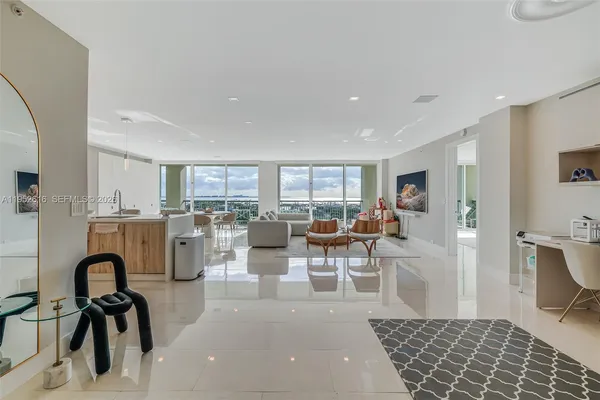 a living room with lots of furniture and a rug