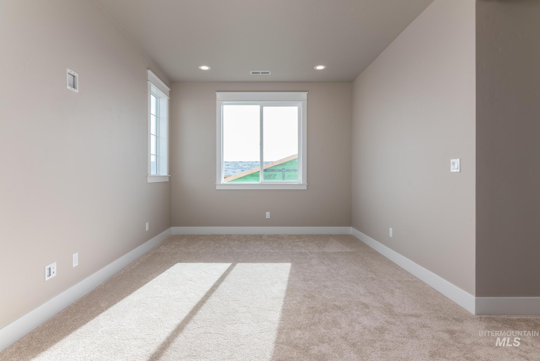 15249 Steel Cloud Avenue Caldwell, ID 83607 - Photo 27 of 46 Spare room featuring light carpet and recessed lighting