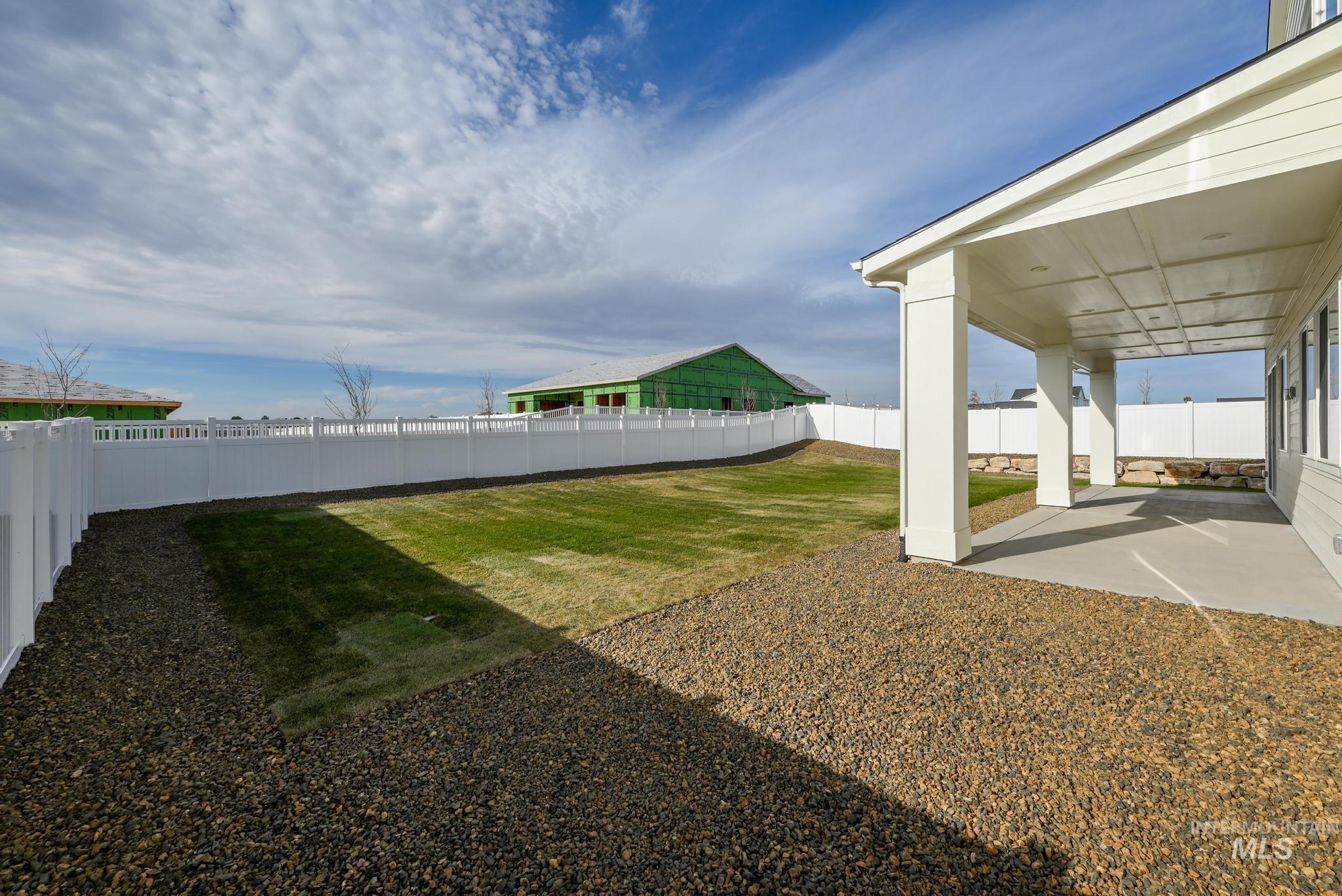 15249 Steel Cloud Avenue Caldwell, ID 83607 - Photo 33 of 46 Fenced backyard with a patio area
