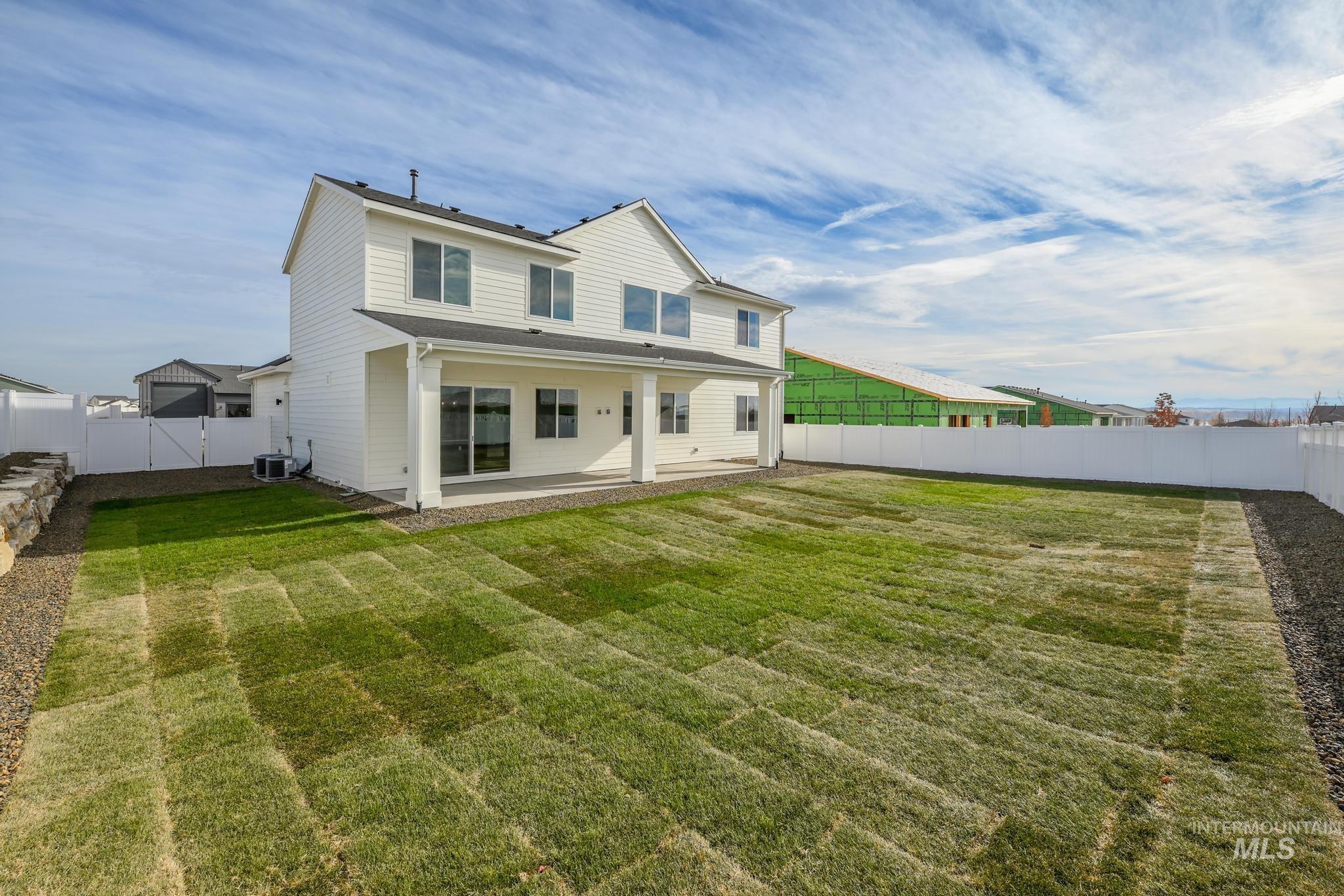 15249 Steel Cloud Avenue Caldwell, ID 83607 - Photo 35 of 46 Rear view of property with a patio area and a fenced backyard