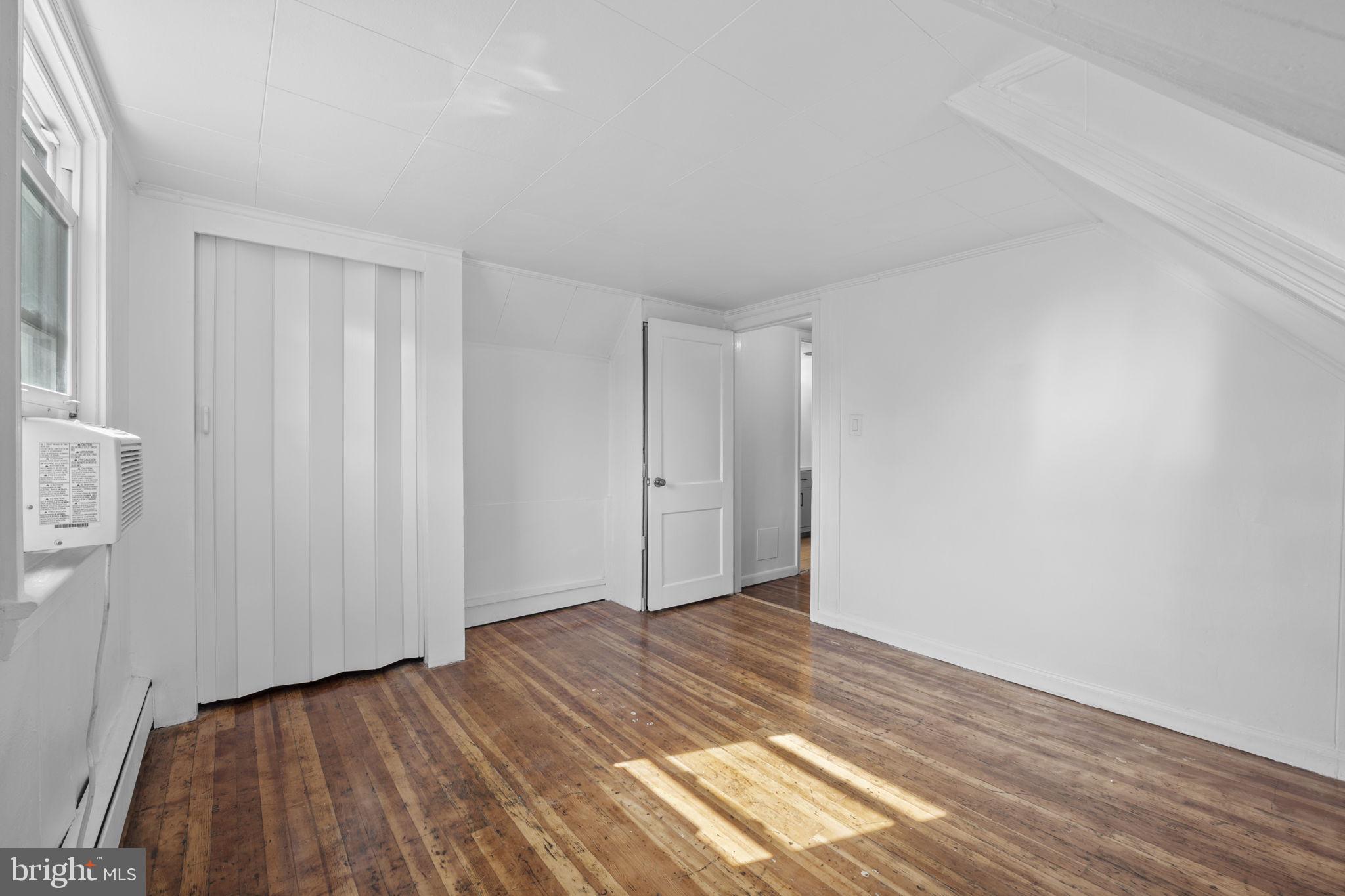 1005 Navahoe Drive Silver Spring, MD 20903 - Photo 19 of 34 a view of a room with wooden floor and closet