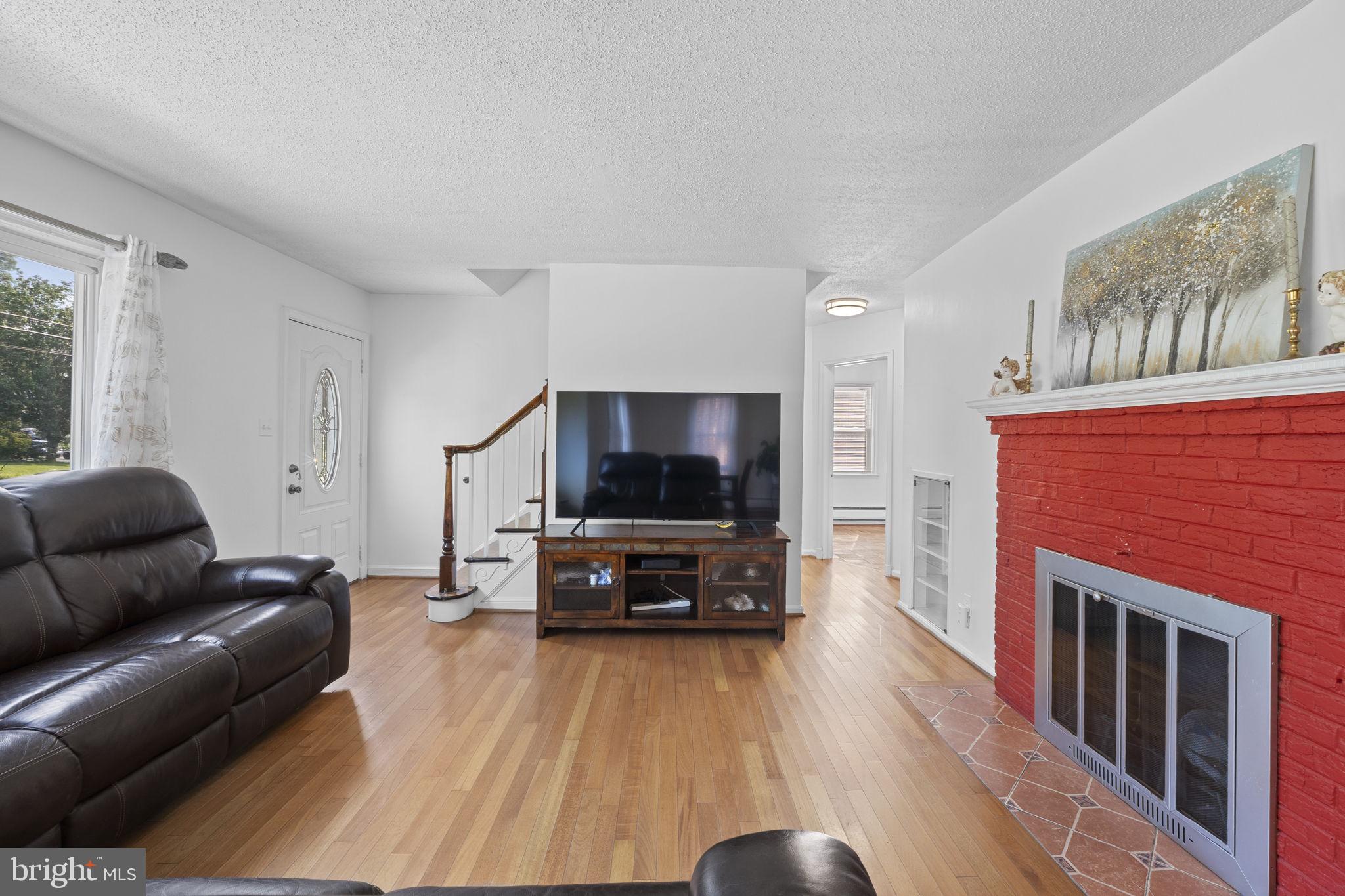 1005 Navahoe Drive Silver Spring, MD 20903 - Photo 9 of 34 a living room with furniture and a flat screen tv