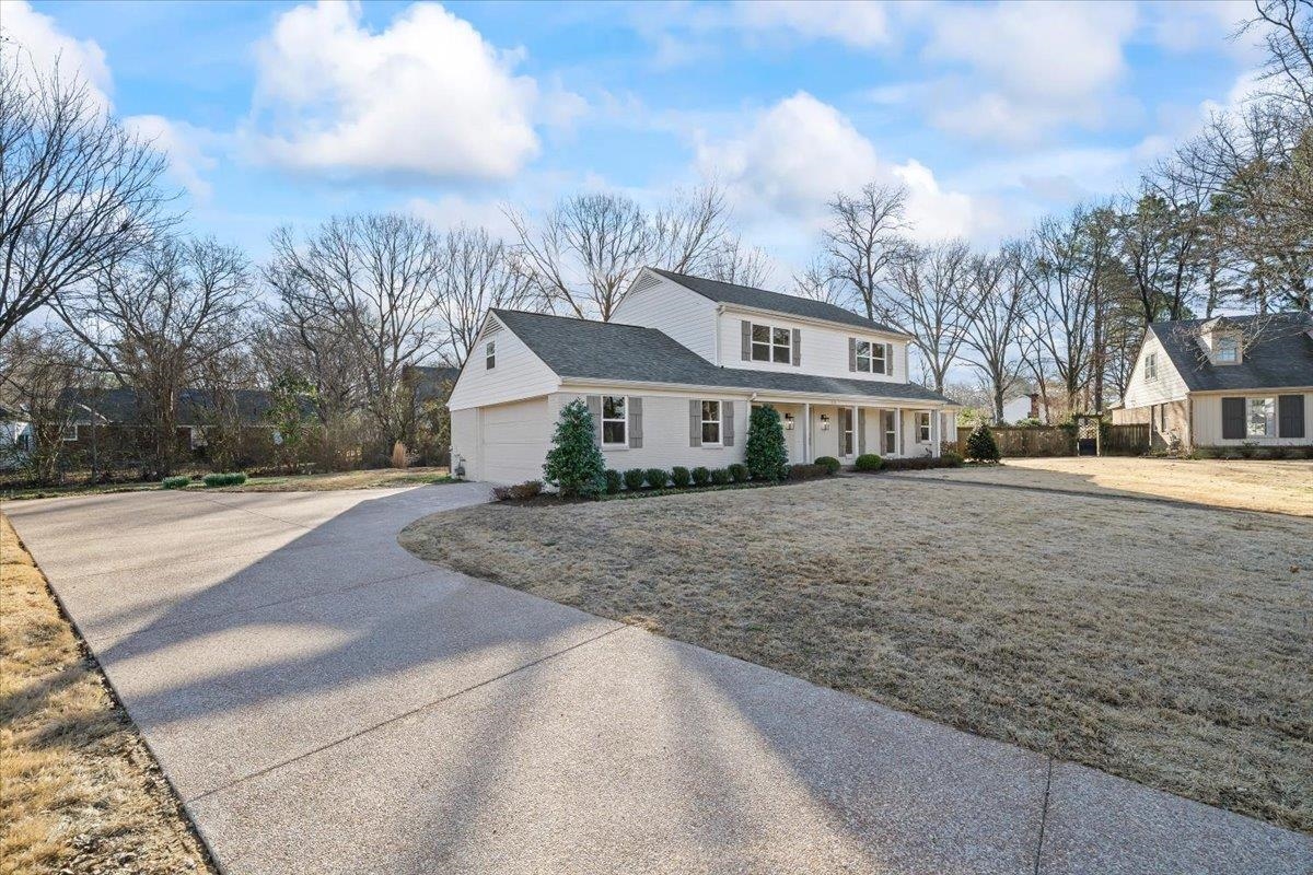 1676 Miller Farms Road Germantown, TN 38138 - Photo 2 of 37 a front view of a house with a yard