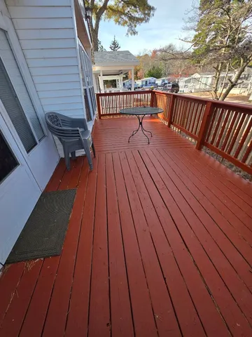 a balcony with wooden floor