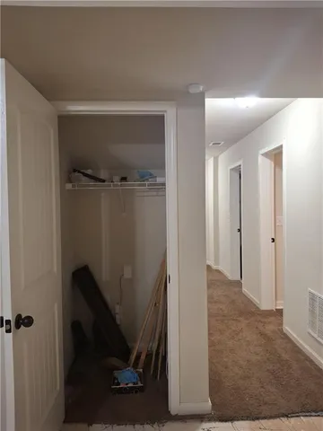 a view of a hallway with closet