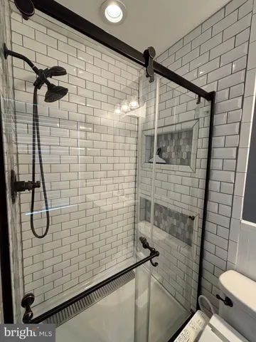 a view of empty room with a fireplace