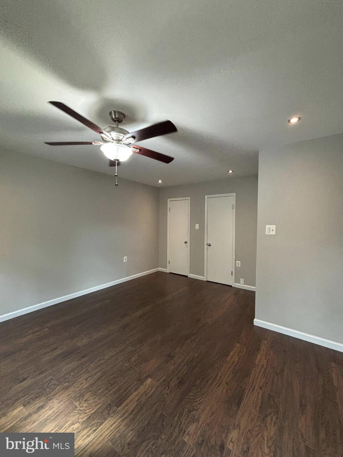 2847 Seminole Road Woodbridge, VA 22192 - Photo 22 of 38 an empty room with wooden floor and chandelier fan