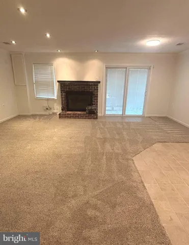 a wooden bench sitting in the middle of a garden