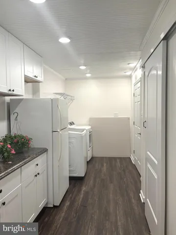 front view of a house with a tree