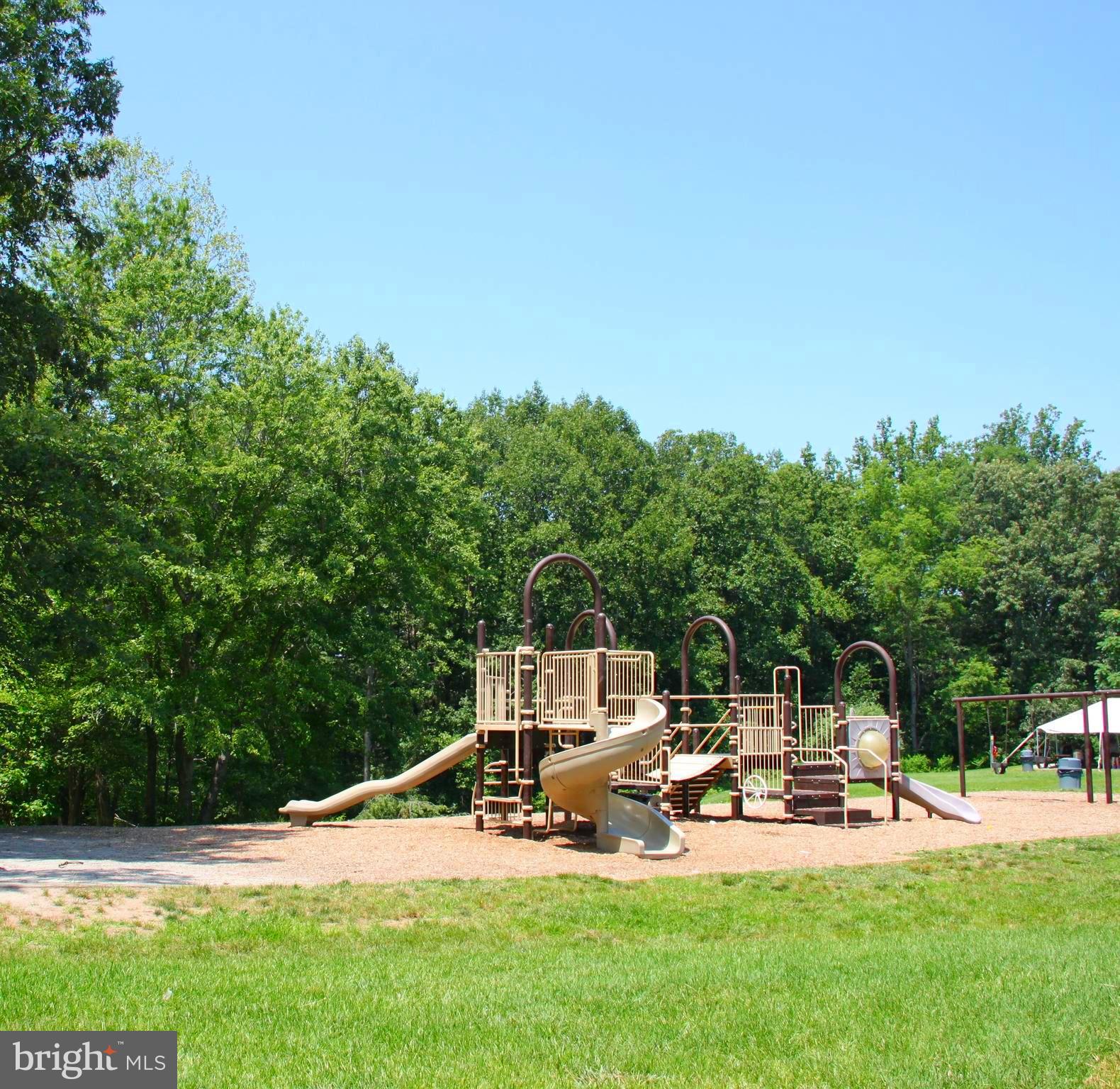 2847 Seminole Road Woodbridge, VA 22192 - Photo 36 of 38 a wooden bench sitting in the middle of a garden