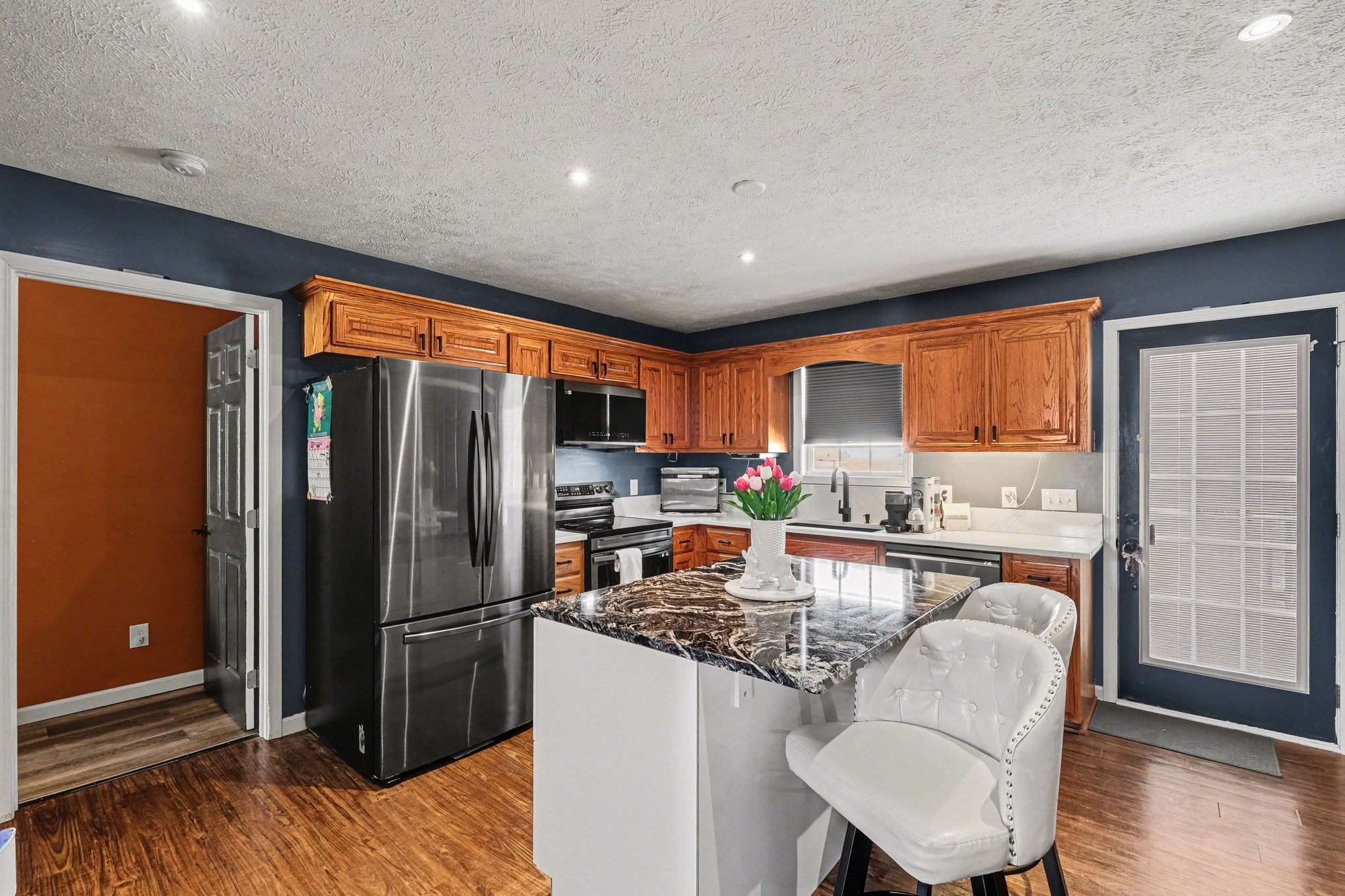 870 Newt Vanattia Road Hillsboro, TN 37342 - Photo 11 of 32 a kitchen with stainless steel appliances granite countertop a refrigerator and a stove top oven