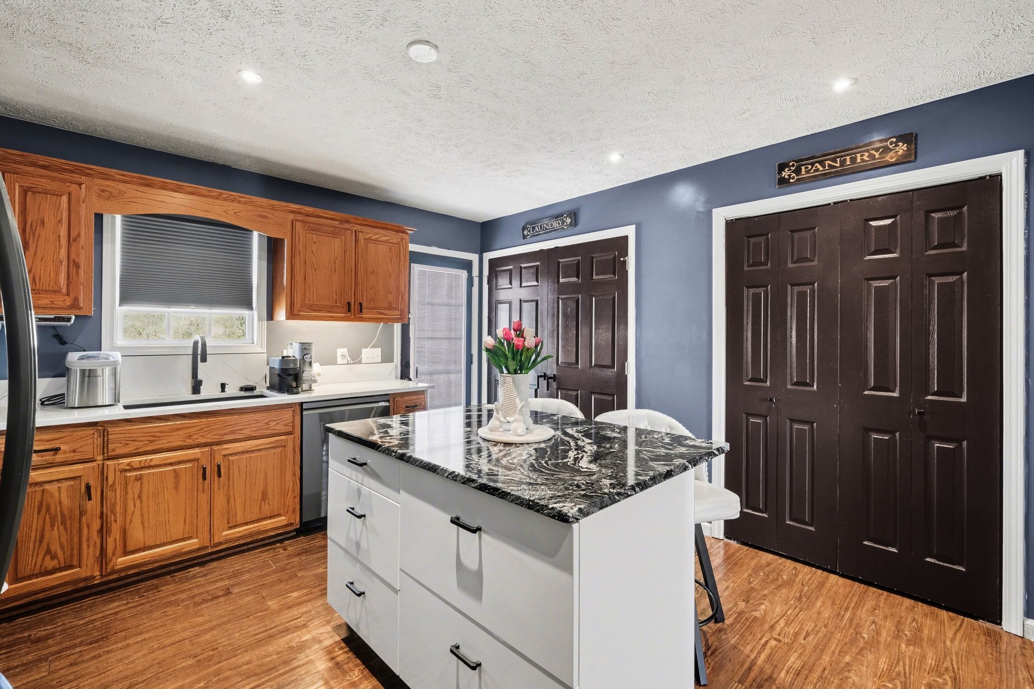 870 Newt Vanattia Road Hillsboro, TN 37342 - Photo 12 of 32 a kitchen with stainless steel appliances granite countertop wooden cabinets and a granite counter tops