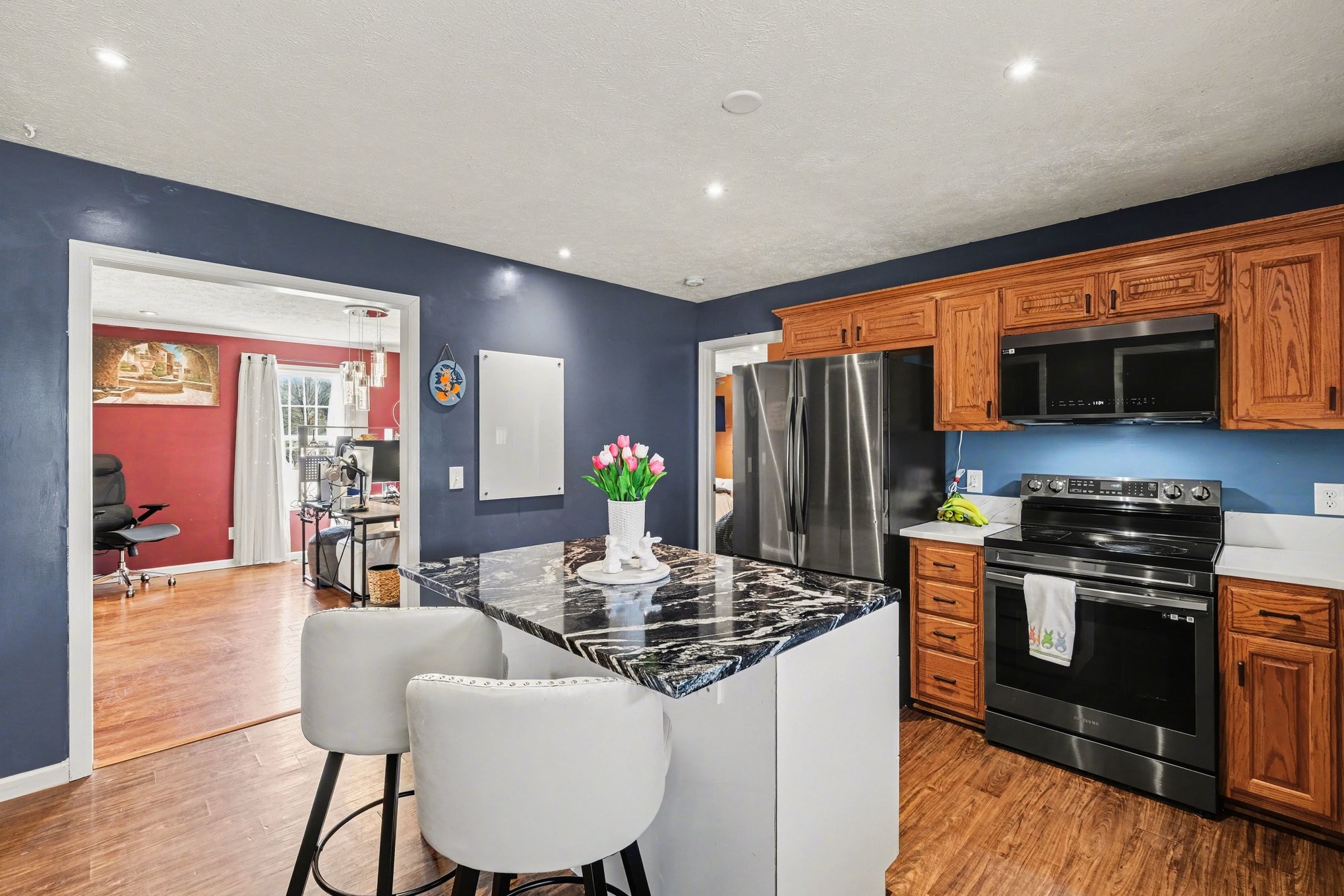 870 Newt Vanattia Road Hillsboro, TN 37342 - Photo 13 of 32 a kitchen with stainless steel appliances granite countertop a stove top oven a sink and a refrigerator