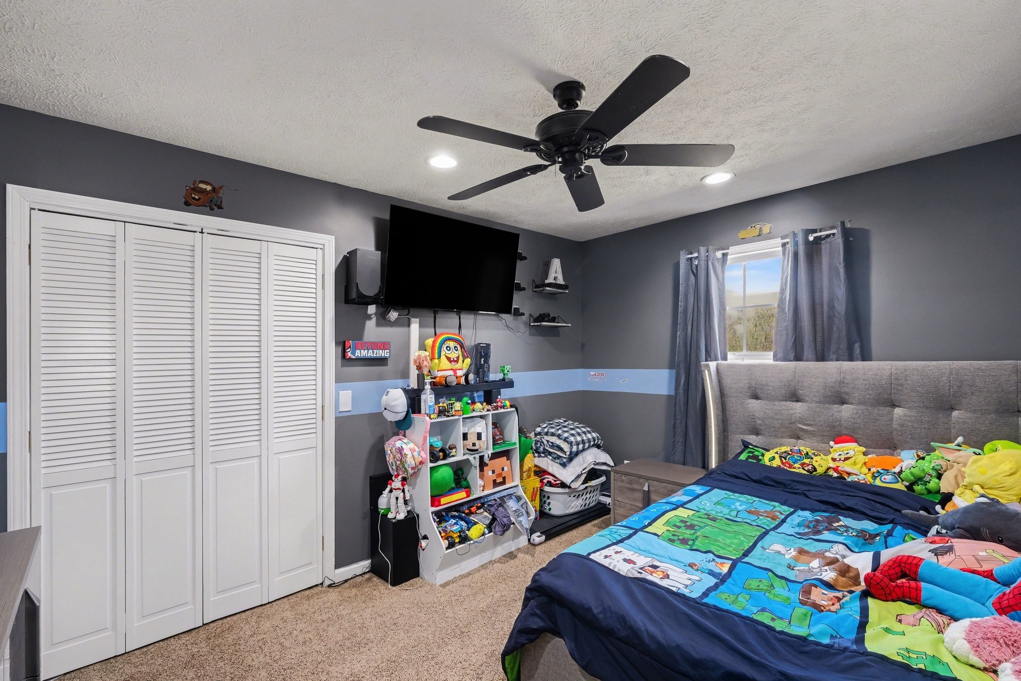 870 Newt Vanattia Road Hillsboro, TN 37342 - Photo 20 of 32 a room with toys and a flat screen tv