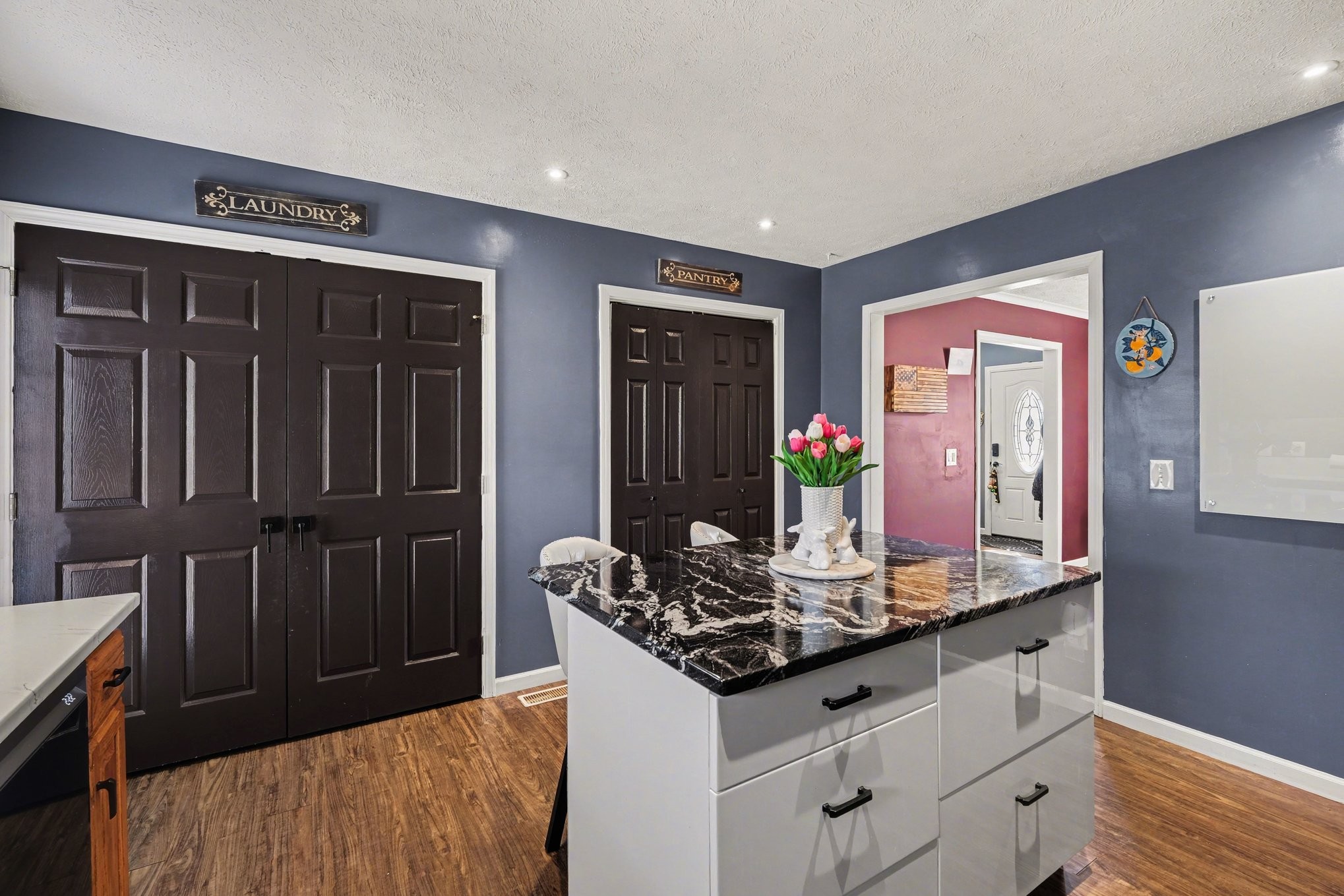 870 Newt Vanattia Road Hillsboro, TN 37342 - Photo 10 of 32 a kitchen with kitchen island granite countertop a refrigerator and a stove