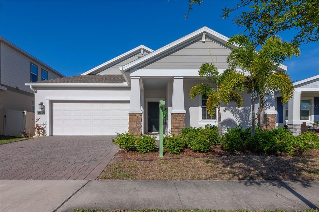 2750 Slash Way St. Cloud, FL 34771 - Photo 1 of 1 a front view of a house with a yard and garage