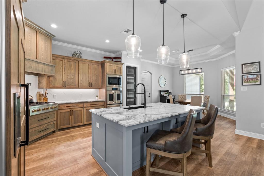 Tbd Tbd Anchor Point Quinlan, TX 75474 - Photo 8 of 40 a kitchen with granite countertop a table chairs stove and cabinets