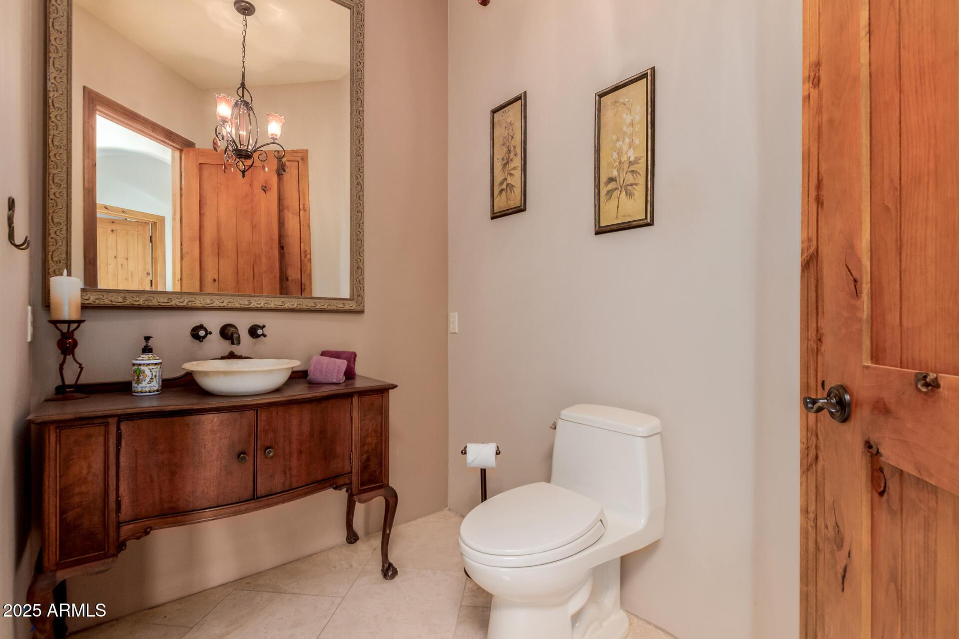 8540 East McDowell Road, Unit 121 Mesa, AZ 85207 - Photo 13 of 35 a bathroom with a toilet sink and mirror