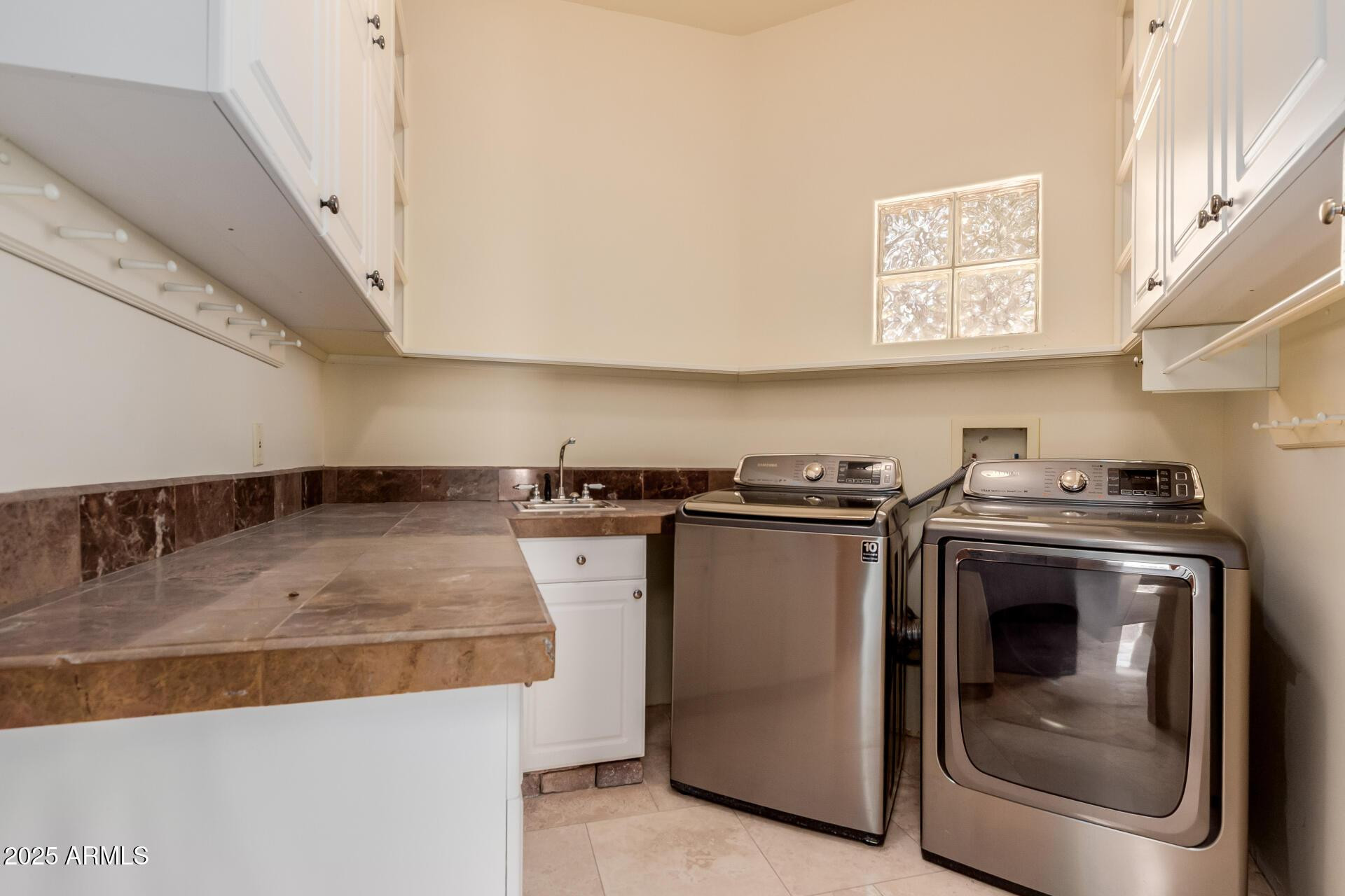 8540 East McDowell Road, Unit 121 Mesa, AZ 85207 - Photo 20 of 35 a utility room with washer and dryer