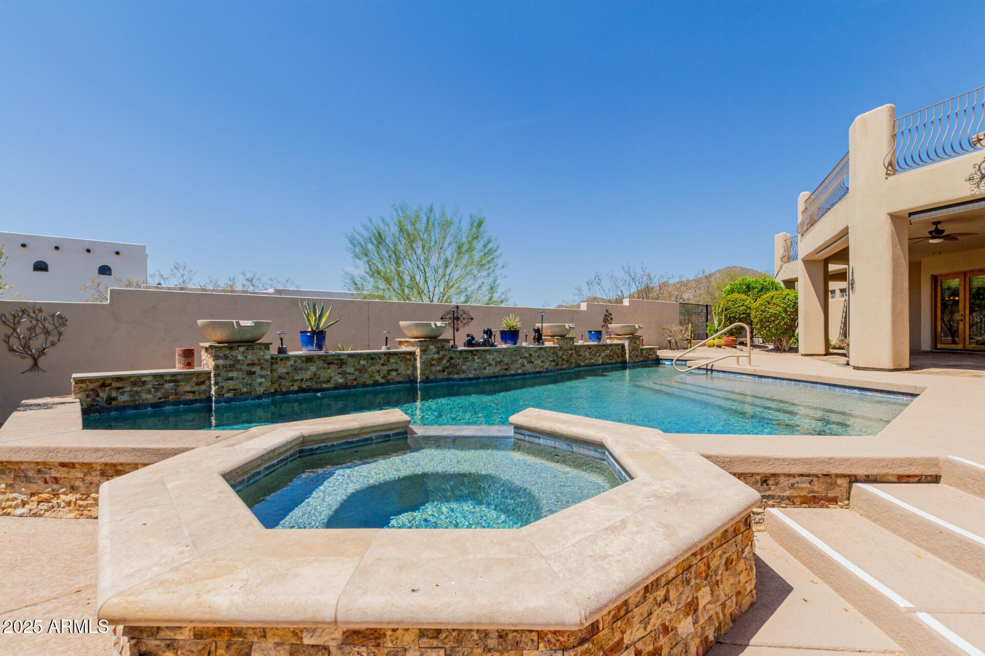 8540 East McDowell Road, Unit 121 Mesa, AZ 85207 - Photo 29 of 35 a view of a house with a swimming pool