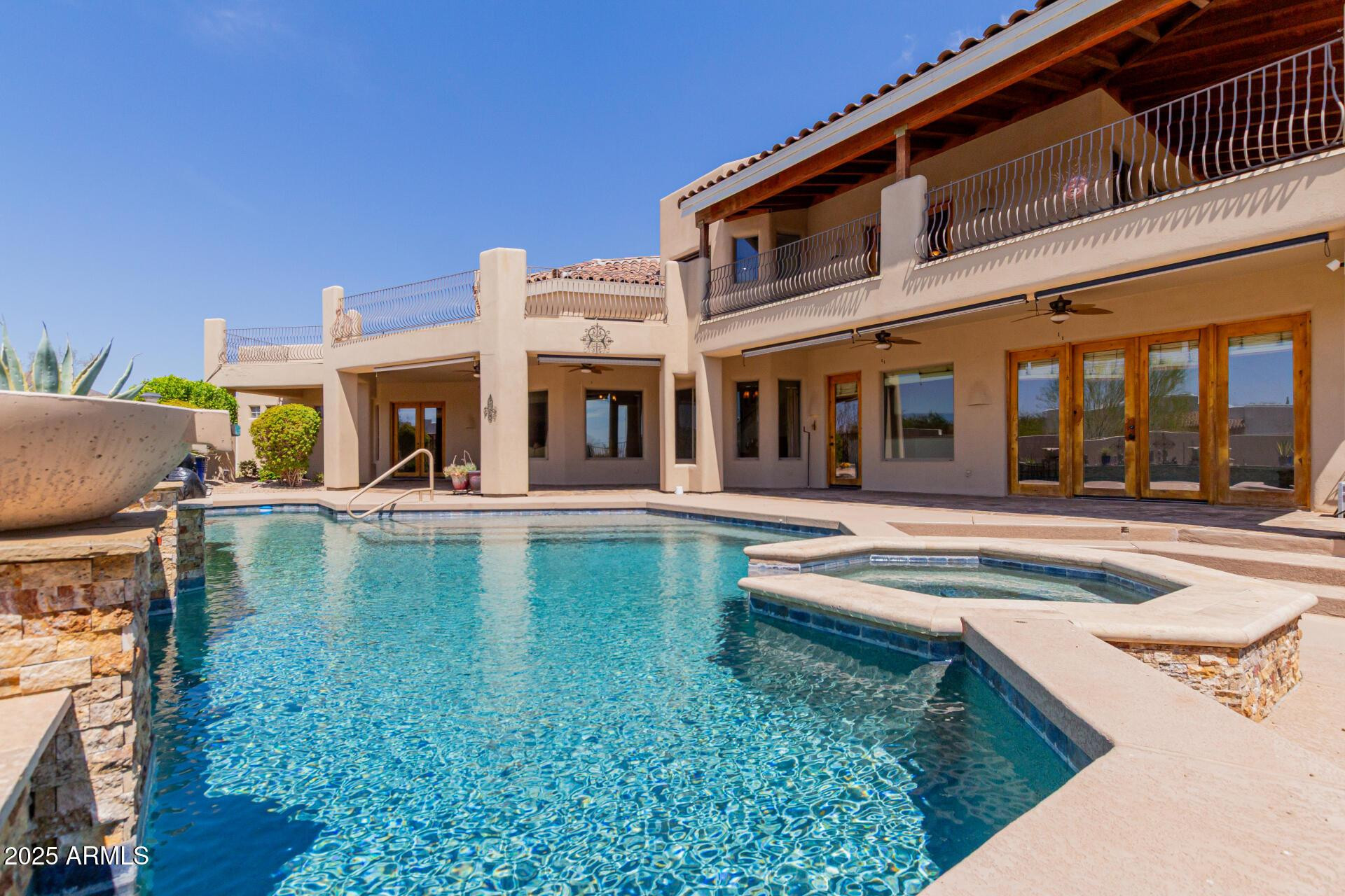 8540 East McDowell Road, Unit 121 Mesa, AZ 85207 - Photo 30 of 35 a swimming pool with outdoor seating