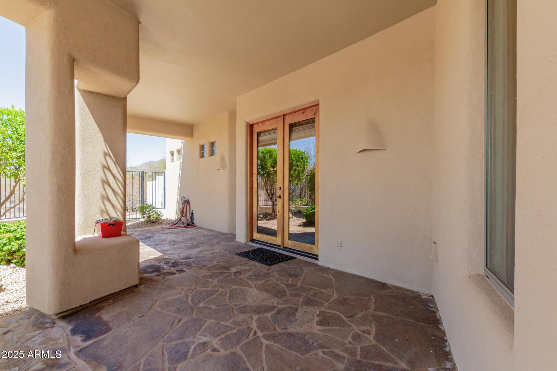 8540 East McDowell Road, Unit 121 Mesa, AZ 85207 - Photo 33 of 35 a living room with furniture and a large window