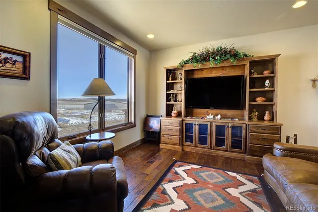 a open kitchen with stainless steel appliances granite countertop a stove and a refrigerator