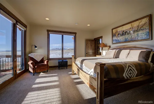 a bathroom with double vanity sinks and a large mirror