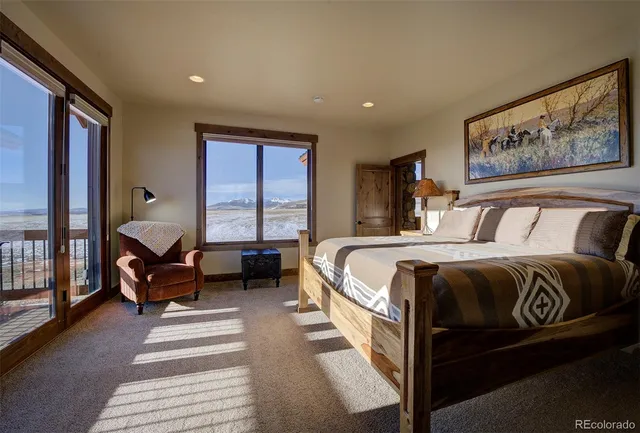 a bathroom with double vanity sinks and a large mirror