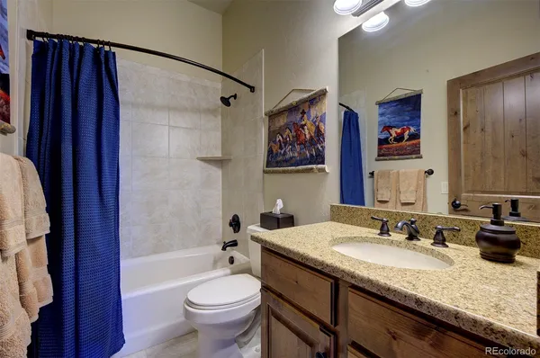 a living room with gym equipment and a window