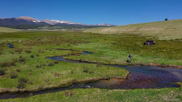 a view of a lake with a yard