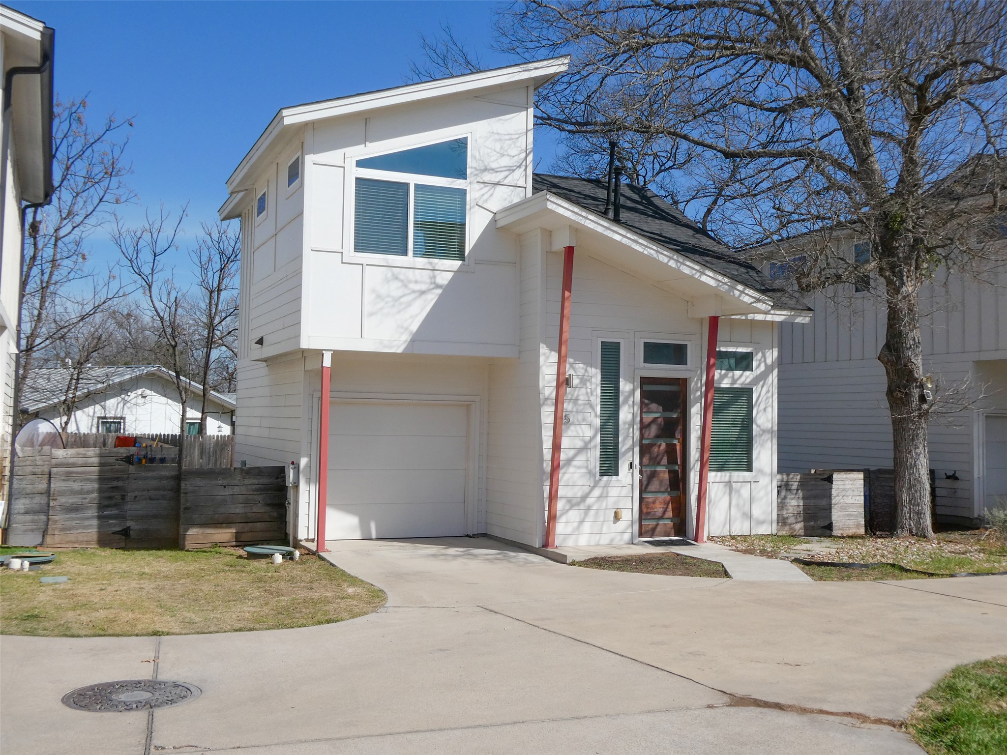 a front view of a house with garage