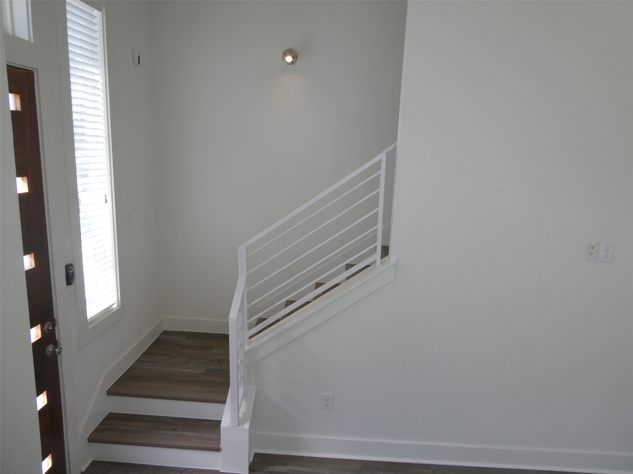 2512 Wheless Lane, Unit 5 Austin, TX 78723 - Photo 11 of 21 a view of staircase with white walls and windows