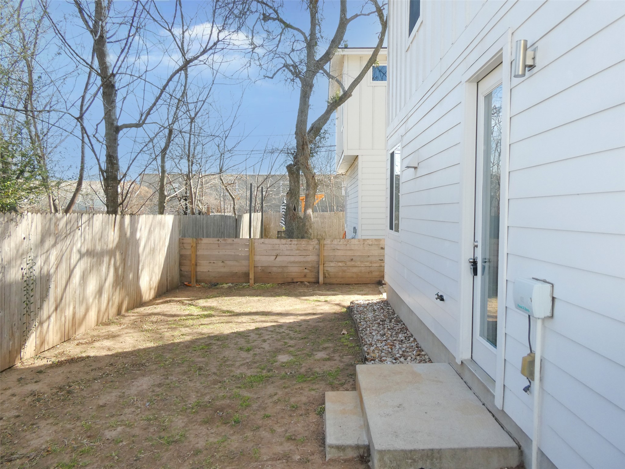 2512 Wheless Lane, Unit 5 Austin, TX 78723 - Photo 21 of 21 a view of a pathway of a house with trees