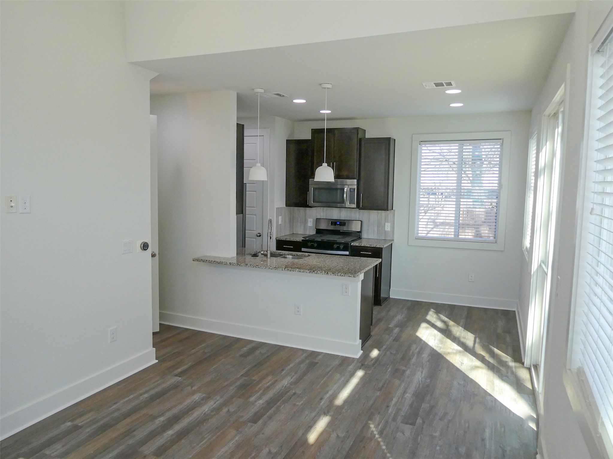 2512 Wheless Lane, Unit 5 Austin, TX 78723 - Photo 6 of 21 a kitchen with a refrigerator and a stove top oven