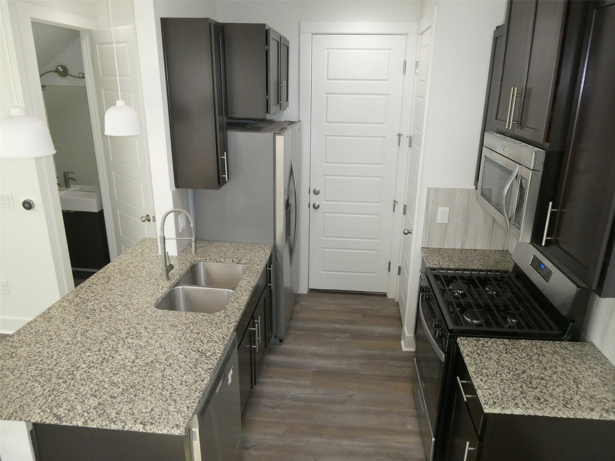 2512 Wheless Lane, Unit 5 Austin, TX 78723 - Photo 7 of 21 a kitchen with sink stove and refrigerator