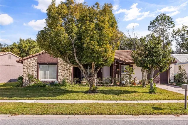 a view of a house with a yard