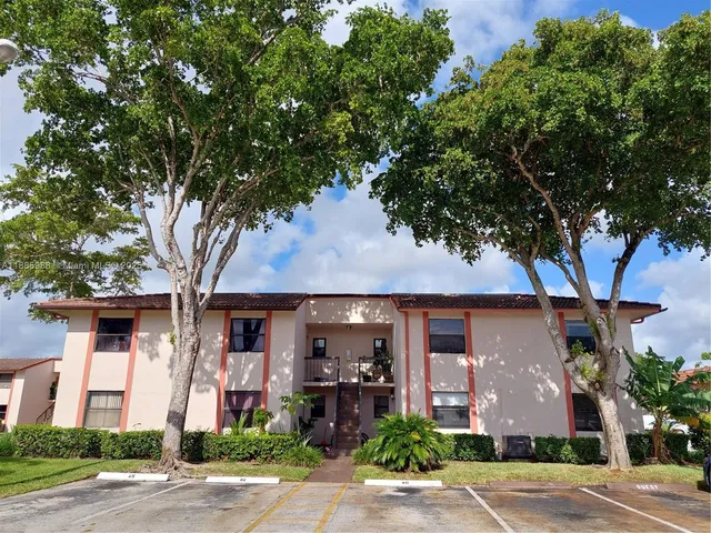 front view of a house with a tree
