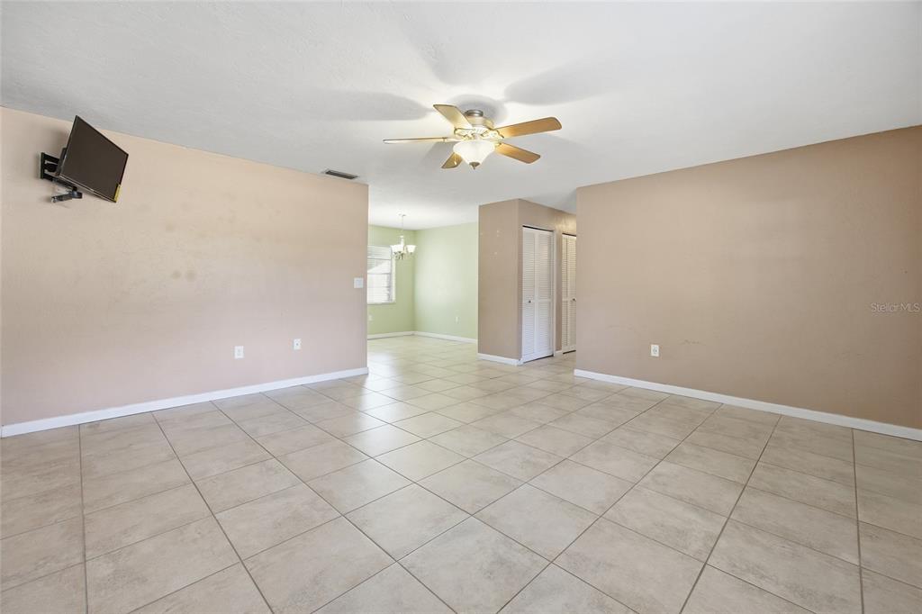 2140 Northeast 39th Street Ocala, FL 34479 - Photo 14 of 28 an empty room with windows and fan