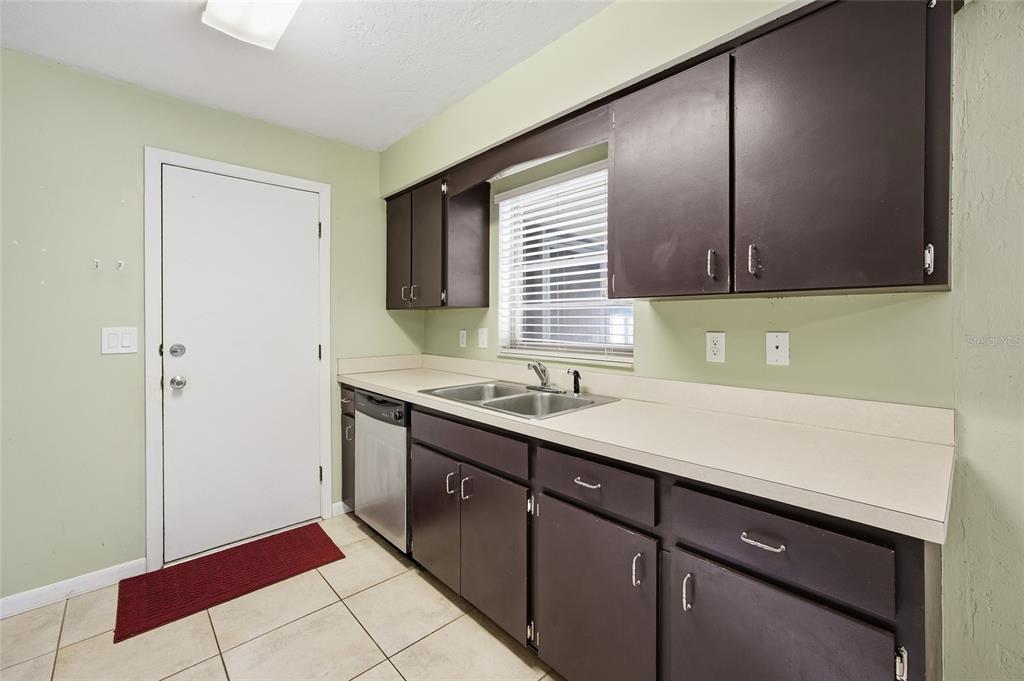 2140 Northeast 39th Street Ocala, FL 34479 - Photo 18 of 28 a kitchen with a sink cabinets and a window